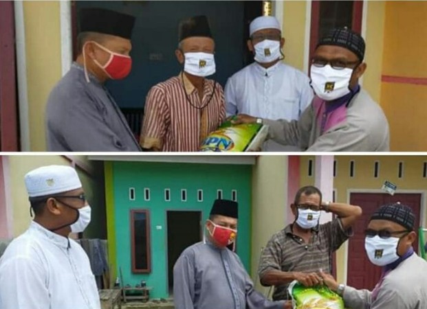 Anggota DPRD Siak Kusman Jaya Serahkan Bantuan Perlengkapan Cuci Tangan dan Beras