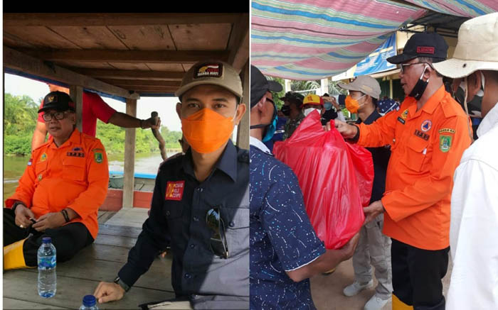 Terobos Pakai Pompong, Bupati Rohil Suyatno Serahkan Bantuan Sembako Untuk 91 KK Korban Banjir