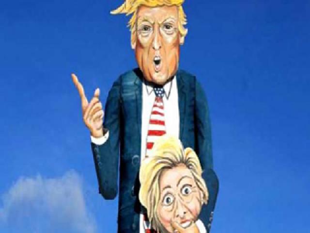 Dibakar, Sosok Trump  Raksasa Dekap Kepala Hillary