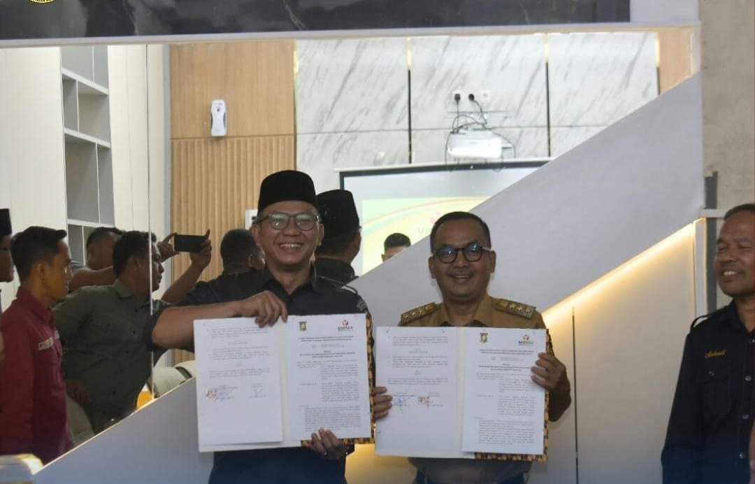 Pemkab Kampar Teken NPHD Rp76 Miliar Untuk Pilkada 2024